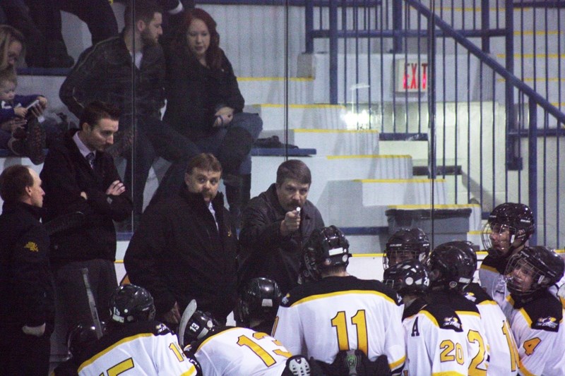 Steelers head coach Trevor Whiting (L) and assistant coach Al Starman (R) take a minute to talk strategy with their players during a time-out in the third period of Wednesday 