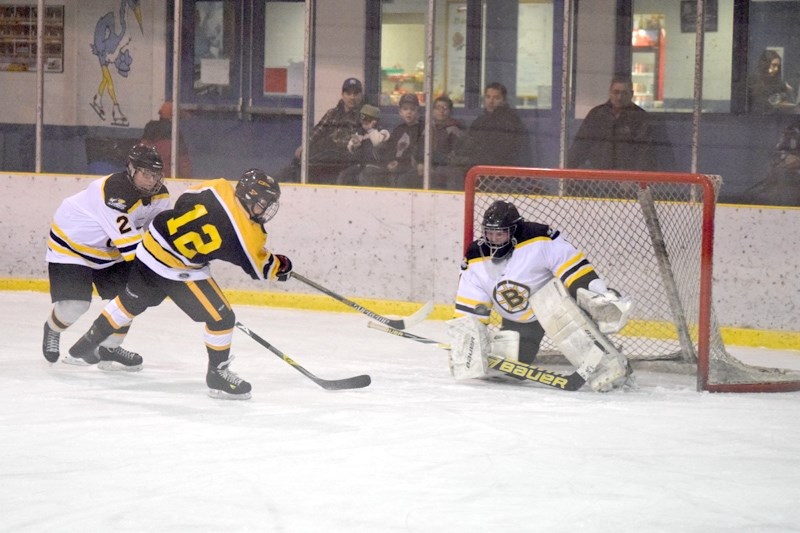 Mathew Carstairs, starting goaltender for the Pirates, makes a save on a close in chance in the first period.