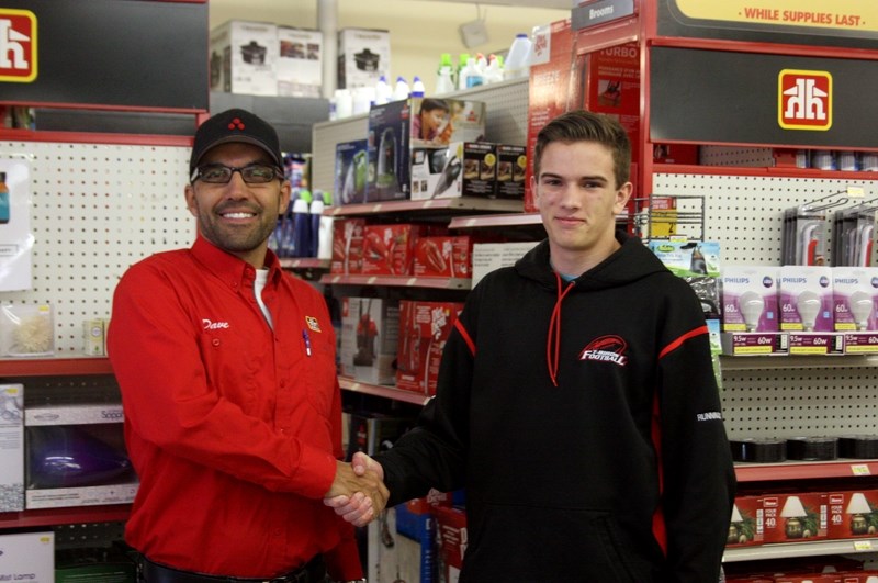 Barrhead &#038;District Chamber of Commerce President Dave Sawatzky shakes Student of the Month Thomas Dittmer &#8216;s hand at Sanderman &#8216;s Home Hardware on Feb. 25.