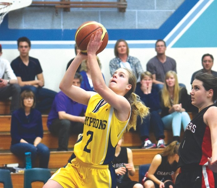 Stephanie Dewaal goes up for a layup in a game against Whitecourt.