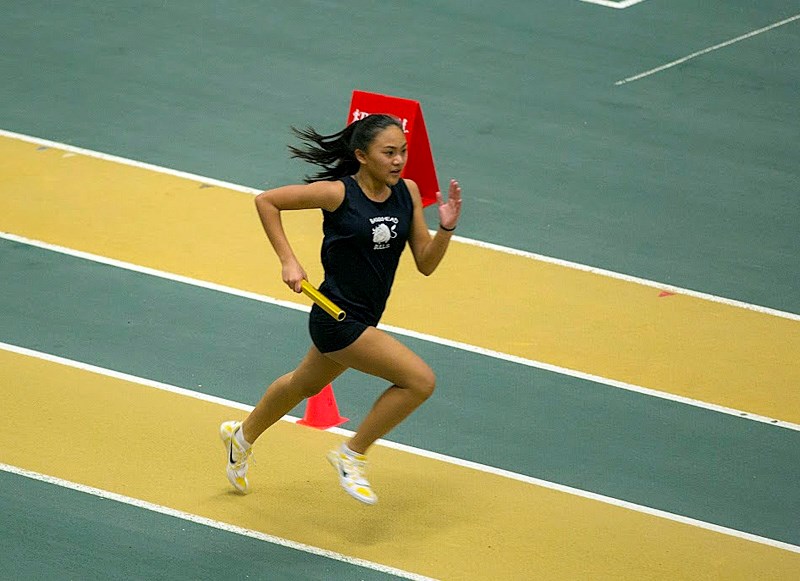 Gracie Versoza sprints down the track duirng the Running Room Indoor Games Finals in Edmonton.