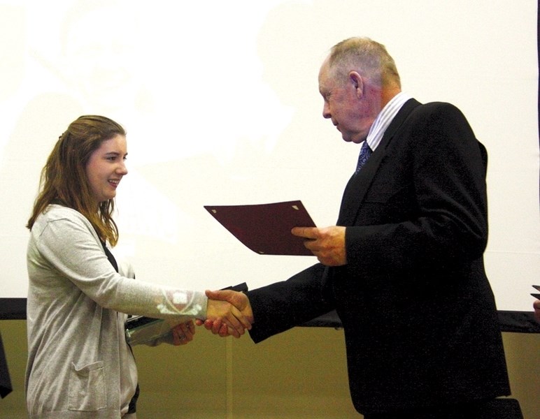 County of Barrhead reeve Bill Lee (r) congratulates Rylyn Laing on winning the Youth Service Award.