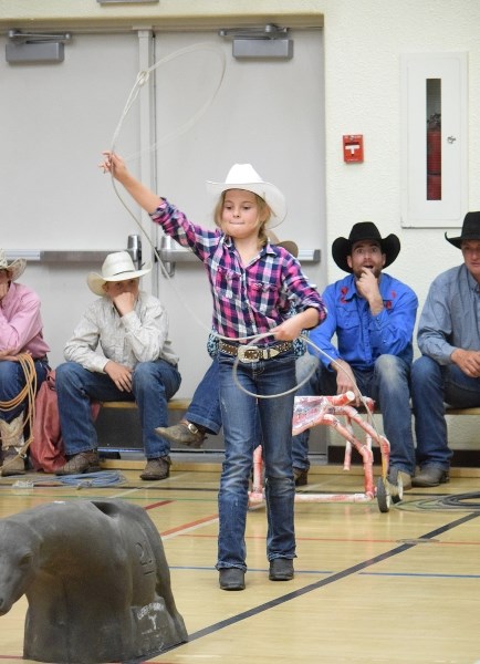 Emilee Bradet tries her hand at steer roping.