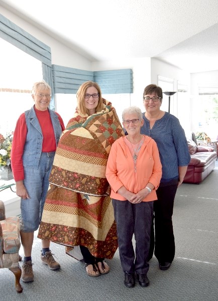 From left: Aurelia Spronk, Erin Kuric, Healthy Families Healthy Futures, Elaine Toma and Sylvia Vadersluis. On Tuesday, Oct. 4, a group of quilters from Quilting from the