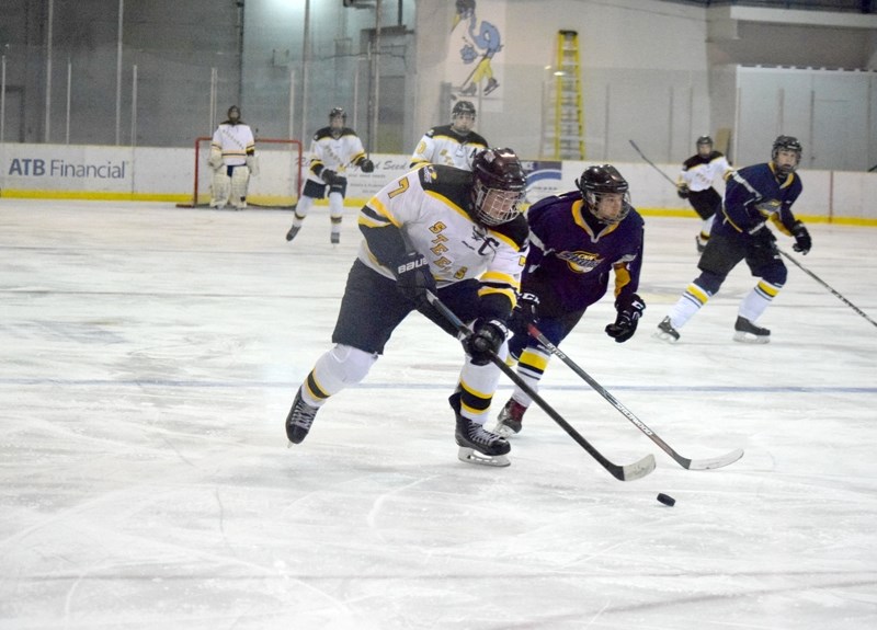 Steeler captain Tanner Whiting drives to the net in the second period.