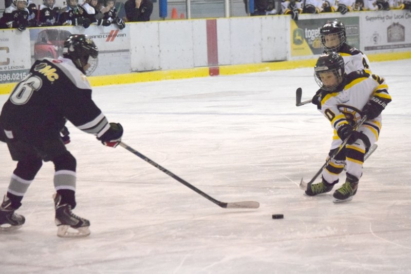 Tayson Hallock uses his speed to try to beat his Leduc opponent during a late rush in the third period.