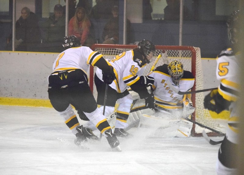 Ty Steinbring, on in relief, makes a stop in traffic in the third period.