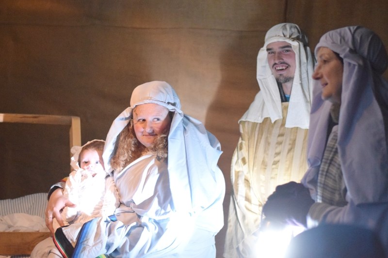 The Benhadad family is brought to see Mary and Joseph (Nancy and Matt Mahar) along with baby Jesus (Jake Mahar) by their guide Rachel (Tracy Pandachuk) to the stables where