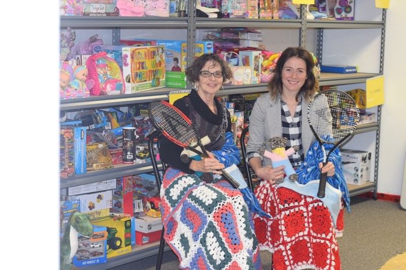 Barrhead and District FCSS Community and Development co-ordinator Ros Rudd (l) and Robin Kapler advocacy and support co-ordinator pose with some of the donations Santa