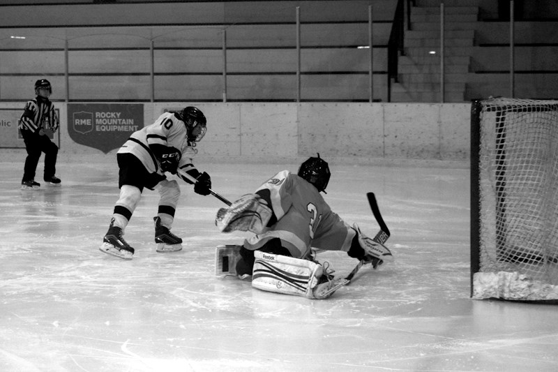Flyer Owen Stoik just misses scoring on close-in forehand deke.