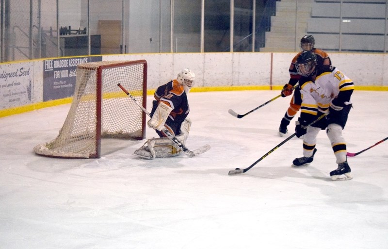Mitchel Carstairs goes to his backhand on a close in chance in the third period.