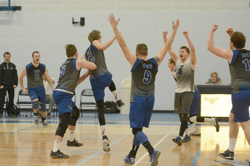 Cameron Gelderman, second from right, celebrates a victory with his team.