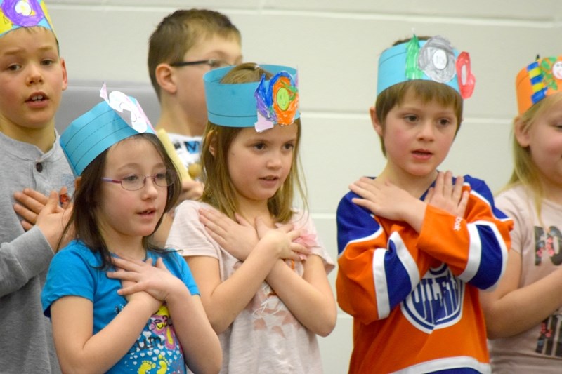 From left : Lily-Anne Slomp, Nora Jack and Quinton Duerr perform &#8216;This is the Day &#8216; as part of the Grade 1 and 3 choir.