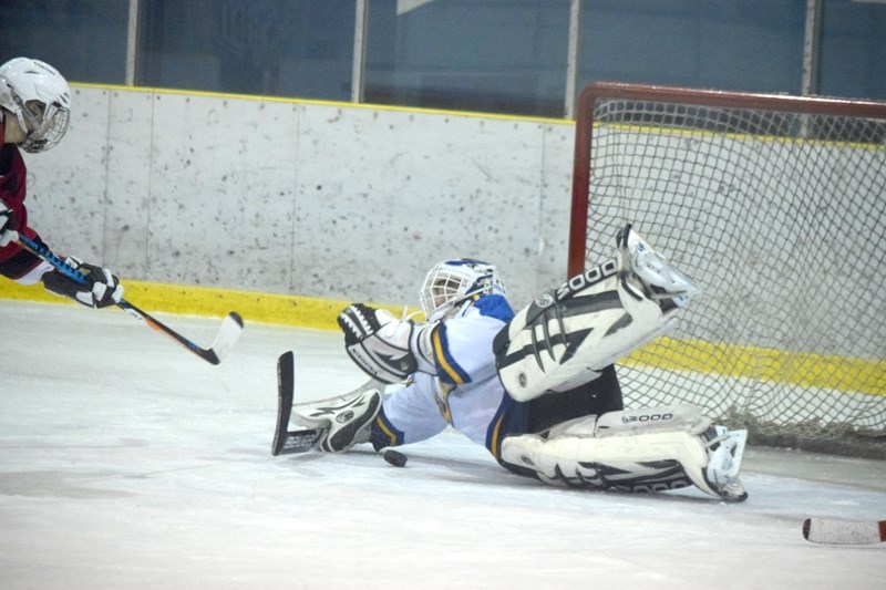 Laurena Anderson makes a diving save in the first period for the Rich Valley Rage women &#8216;s team in a game against the Leduc Chiefs. The Rage lost the game 5-1.