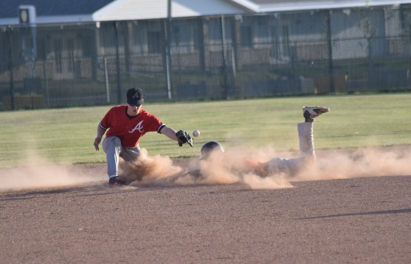 Players like Lee Worbec, seen here sliding into second during the Barrhead Orioles midget teams home opener last year, won &#8216;t have a team to play on after an