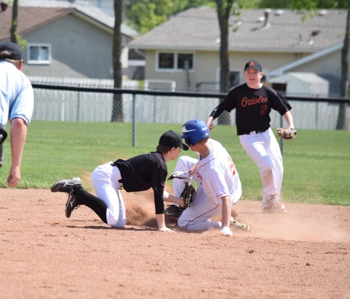 Keenan Fortier tagging out a runner at second in the sixth inning.