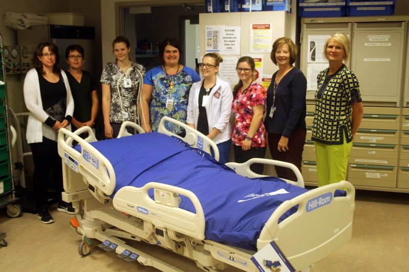 The Barrhead Health Care Centre &#8216;s palliative care unit received its newly purchased beds on June 2. Pictured with one of the $18,000 units are (From left to right):
