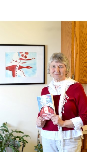 Glenice Wilson holds up her copy of Chicken Soup For the Soul: The Spirit of Canada. On June 13, she will join more than 30 of her co-authors for the book &#8216;s official