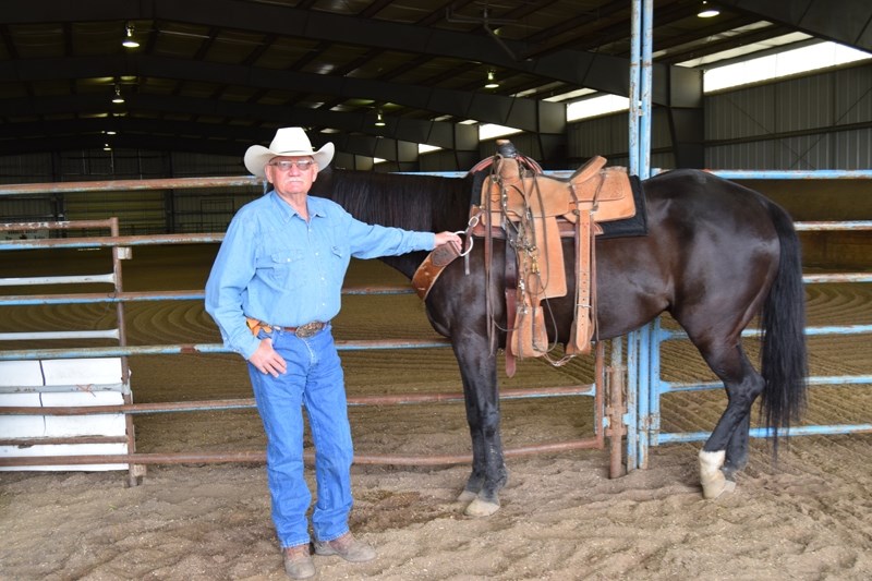 Mosside area resident Chris Rogers competes in the team roping event as a header with his partner Betty Adams.