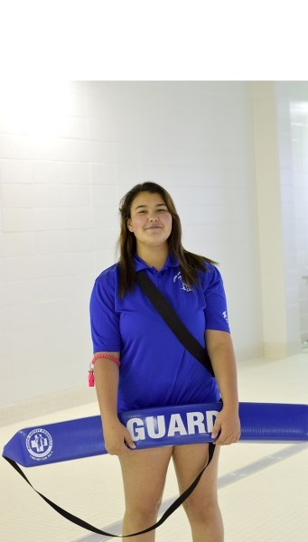 Ashley McCarthy, Grade 11 Barrhead Composite High School student, takes a brief break to pose for a picture on Aug. 8. McCarthy is one of the more than 25 lifeguards at the