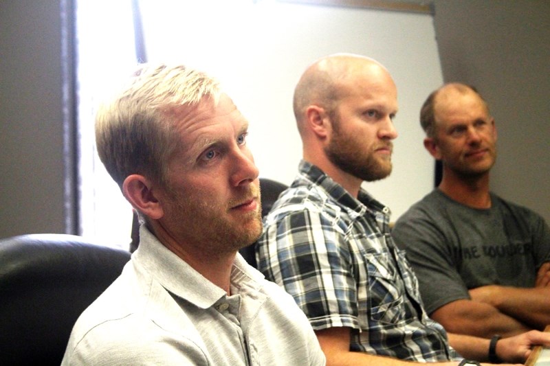 Zack Olthuis (l) and Caleb Wierenga (r), two members of a five-person delegation representing the Linaria Agricultural Society, presented County of Barrhead council with a