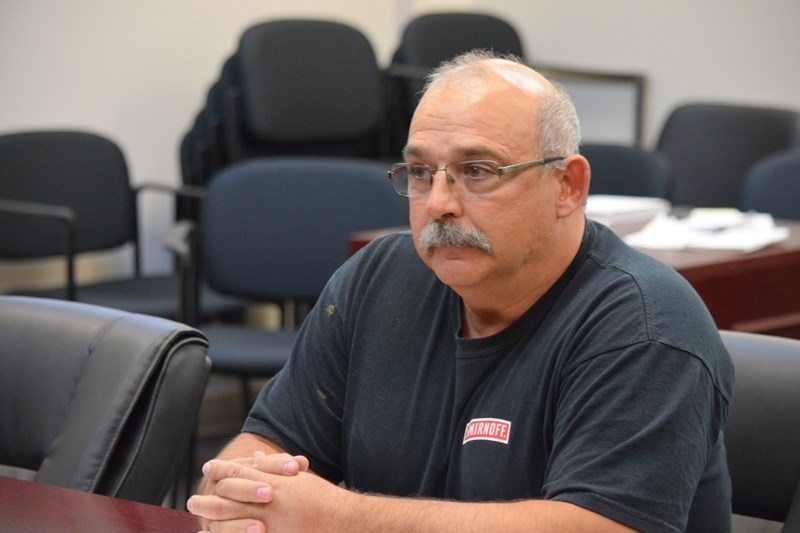 Public Works fleet manager Chris Shembri explains some of the specifications of the new garbage truck the town will be ordering.