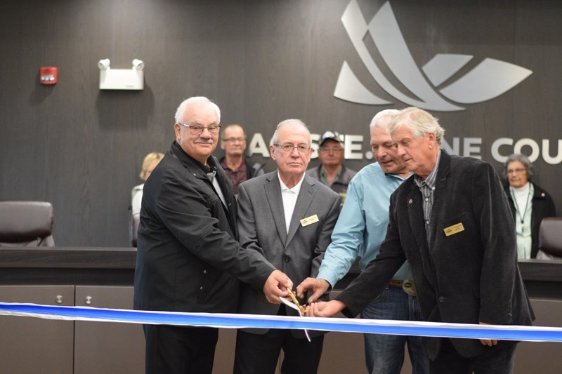 From left: Lac Ste Anne councillors Wayne Borle, Div. 3, mayor Bill Hegy, Ross Bohnet, Div.6 and Lloyd Giebelhaus, Div. 7 getting ready to cut the ceremonial ribbon.