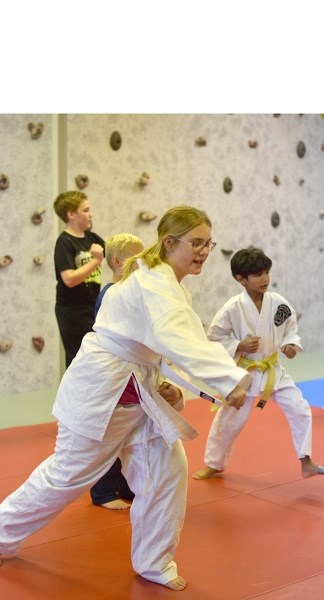 Haley Petiot practices a punching technique the class just learned.