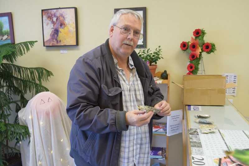 Lloyd Truscott shows off a piece of the &#8220;Berlin Special &#8220;, that was given to him by officials of Spreckens when he visited the village to unveil a memorial