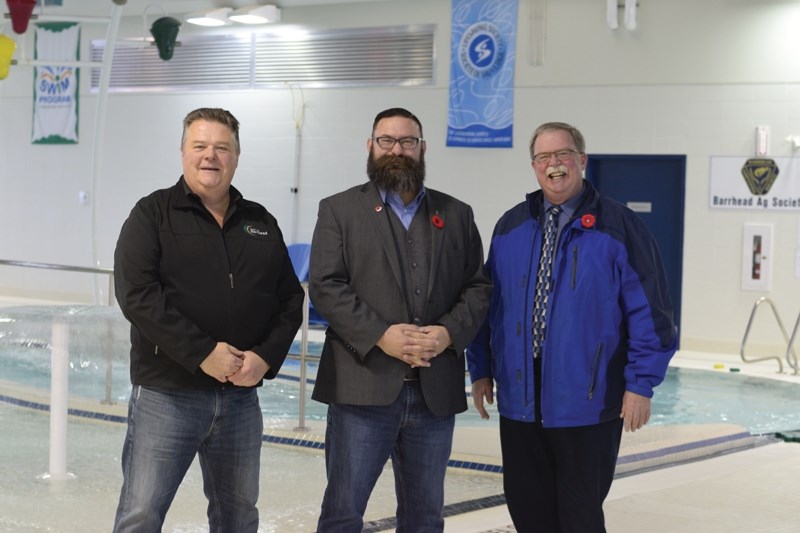 Municipal Affairs minister Shaye Anderson (m) with county reeve Doug Drozd (r) and mayor Dave McKenzie at the Barrhead Regional Aquatics Centre on Nov. 1. Anderson ordered