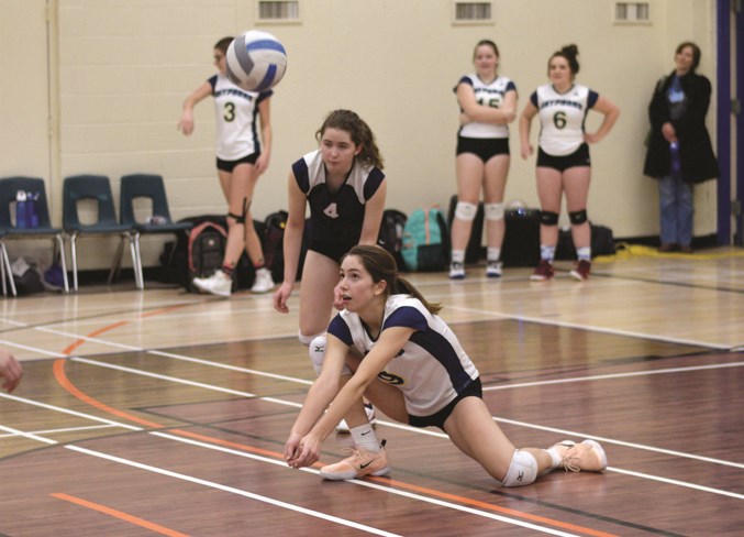 Lauren Kostiw with a dig in the championship match against Morinville.