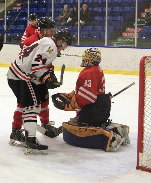 Westlock Senior Warriors’ Scott Ivey gets in close on the Daysland goalie during an 8-1 Jan. 5 loss at the Rotary Spirit Centre. The loss, coupled with an 8-1 defeat in