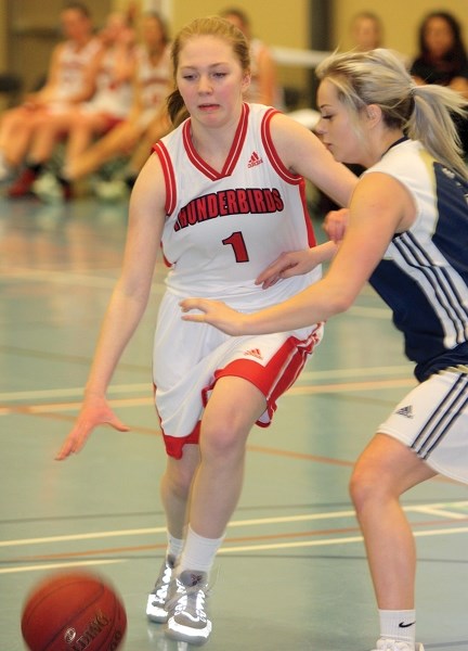 R.F. Staples senior girl Delaiya Dutchak makes her way around an opponent from Vegreville as the team won the first-ever RFS Basketball Invitational at the Rotary Spirit