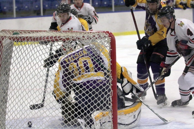 Westlock Warrior Brett Bujold backhands the puck past the Morinville Kings goaltender while teammate Brady Du-charme looks on during the club’s 4-3 Game 3 victory at the