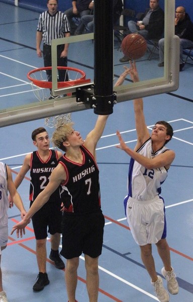 St. Mary Shark Connor Tymkow takes to the air during a 98-23 blowout win over Boyle School during the W.J. Kallal Memorial Senior Boys Basketball Tournament at the Rotary