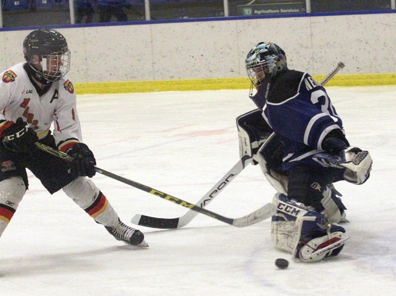 Westlock Warrior Joshua Reagan slips the puck past the Slave Lake goaltender during a 12-0 win at the Rotary Spirit Centre Feb. 10. The club went 2-0 in league play before