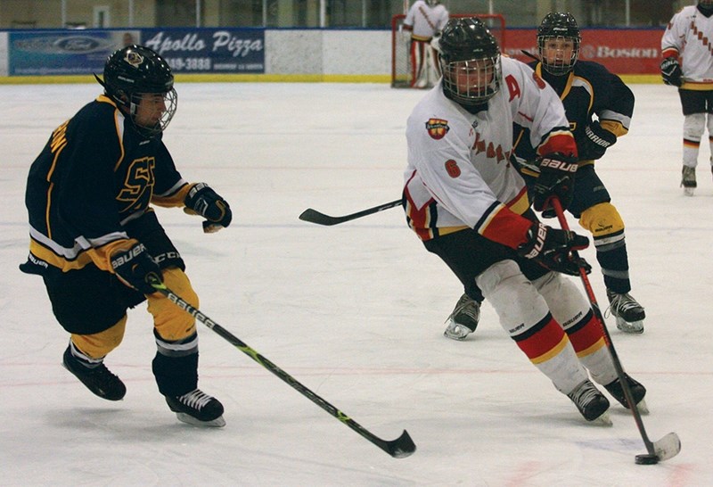 The Westlock Bantam Warriors won their two-game provincial playdown against St. Albert Feb. 16-17. Pictured, Seth Fairholm makes his way around the St. Albert defender at the 