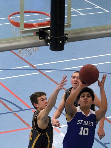 The St. Mary Sharks hosted the Alberta School Athletic Association North Central Zone 1A tournament at the Rotary Spirit Centre March 9-10. Daryl Carino attempts a layup