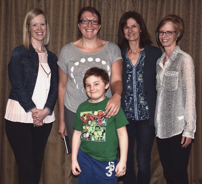 Long Island Lake Society president Nicole Stadnyk, with her son Kaleb, were all smiles after the organization received $10,200 from 100 Women Who Care. The money will be used 