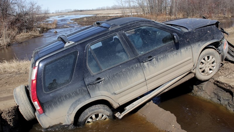 The scene April 23 when an SUV fell through Range Road 263 between Township Road 604 and 610. The passenger suffered a broken hand in the accident.