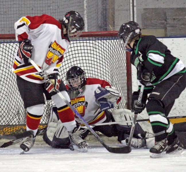 Warriors&#8217; goalie Tyson Pidsadowski tracks down the puck during the club&#8217;s 3-2 Sunday afternoon win over the Smoky Lake Stars.