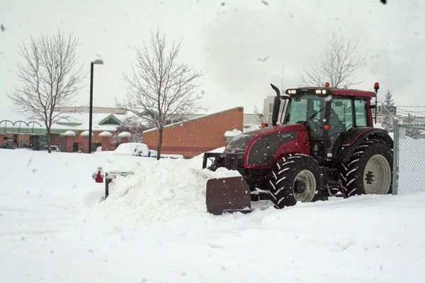 A tractor clears the area in front of the Westlock hospital Saturday afternoon during another heavy weekend dump. The Town of Westlock has now made its snow-clearing