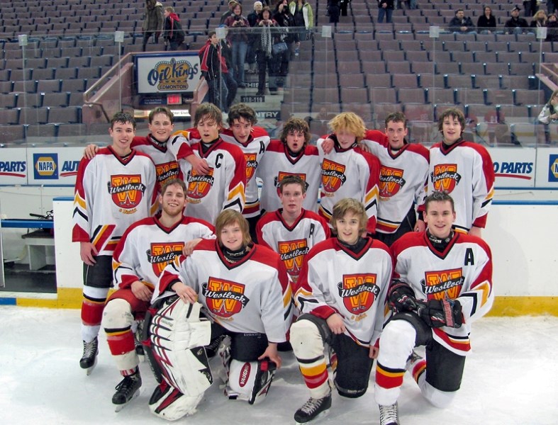 The Westlock Midget Sabres pose for a photo after their game at Rexall Place on Jan. 21. Back row, L-R, Les Zeise, Ryan Latimer, Cody Cobler, Chase Rau, Jake Rothgordt, Cam