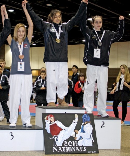 Westlock&#8217;s Kiana Hein (left) celebrates her bronze medal performance at the 2011 Canadian National taekwondo championships in Winnpeg on Jan. 29.