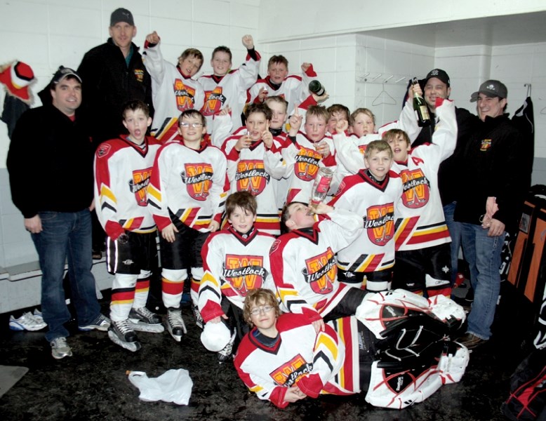 The Westlock Atom Selects celebrate with some non-alcoholic champagne in the locker room following Saturday afternoon&#8217;s zone series win over Barrhead. The Selects