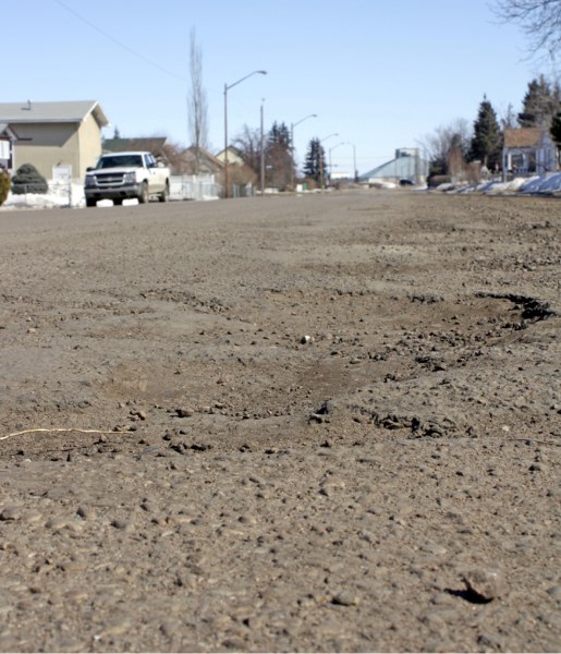 The town and county will be working on repairing potholes, like these ones on 106 Street in Westlock, as the weather warms up and the freeze-thaw cycle comes to an end.