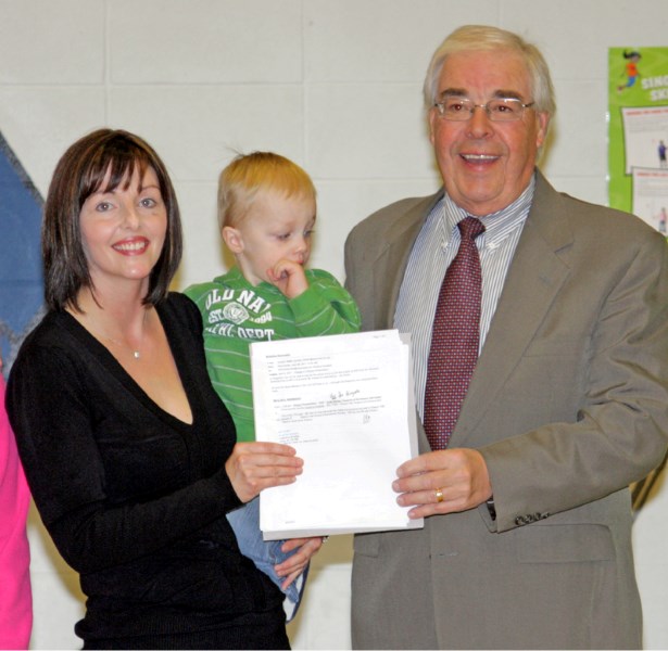 Barrhead-Morinville-Westlock MLA Ken Kowalski presents Eleanor Hall enhancement society treasurer Linda McCoy a cheque for $67,000 as a provincial contribution toward a new