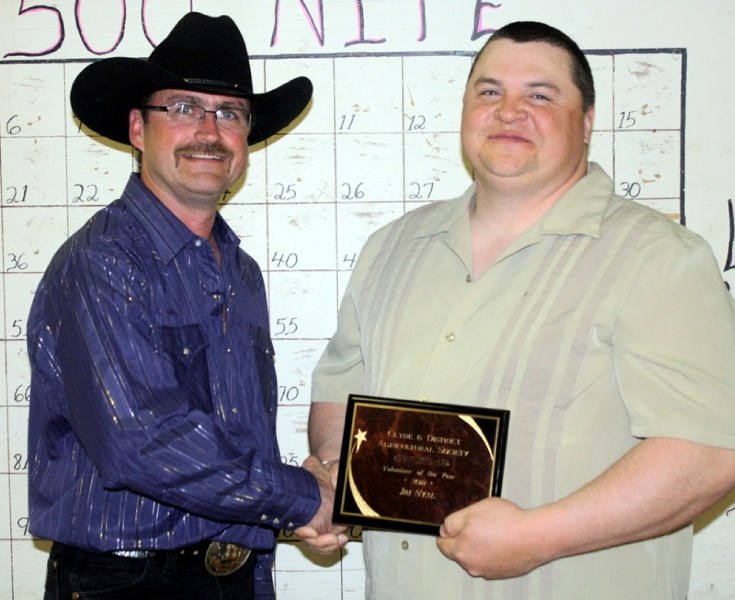 Jim Nyal, right, receives his Clyde Volunteer of the Year award from Clyde Ag Society president Perry Lumayko at the annual Ag 500 fundraiser April 30 at the Clyde Hall.