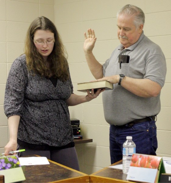 Clyde CAO Melanie Beastall administers the oath of office to new Clyde mayor Wayne Wilcox May 3. Wilcox was sworn in as mayor after being elected in a special organizational