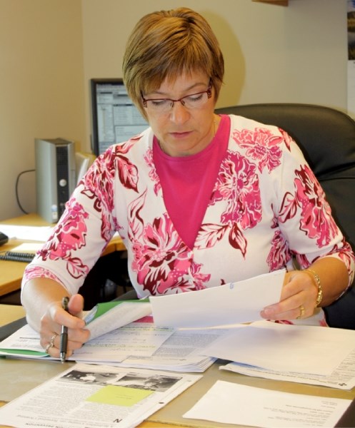 New Westlock hospital site manager Karen Bouman catches up on some managerial paperwork in her office. Bouman took over as hospital manager on May 9.
